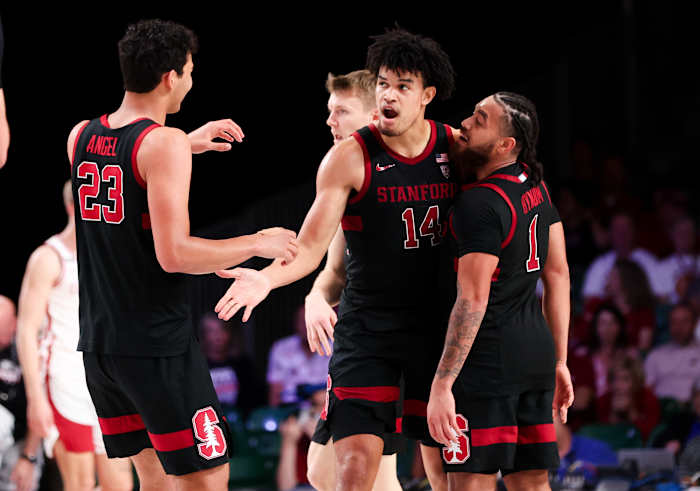 Nov 22, 2023; Paradise Island, BAHAMAS; Stanford Cardinal forward Spencer Jones (14) celebrates with Stanford Cardinal forward Brandon Angel (23) and Stanford Cardinal guard Jared Bynum (1) during the second half against the Arkansas Razorbacks at Imperial Arena. Mandatory Credit: Kevin Jairaj-USA TODAY Sports
